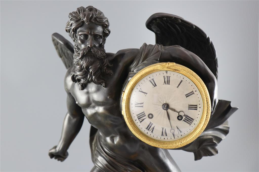 A 19th century French bronze mantel clock, height 17.5in.